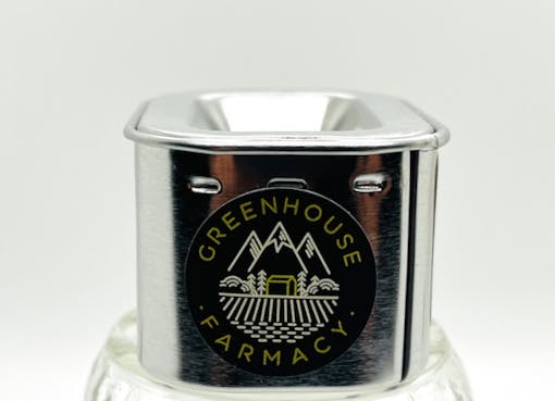 small metal container with round black GREENHOUSE FARMACY sticker on front