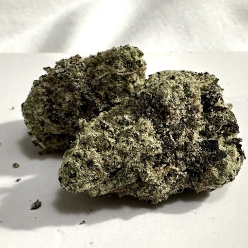 two Dark large purple nugs of Barcelona Club La Selva award-winning Banana Cooler. (David Downs/Leafly)