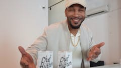 Rodney Carter shows off the merchandise at Trends Dispensary in Long Island City, Queens. Trends carries brands like Chef For Higher (infused cooking essentials). (Meg Schmidt / Leafly)
