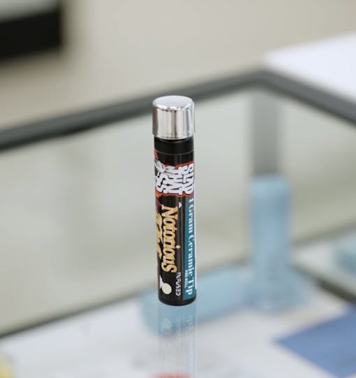 Good Grades Leafly Report Card review of Slap That A$$ Exotics Notorious THC pen.