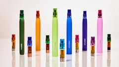 AiroPods in various colors displayed standing up in a line.