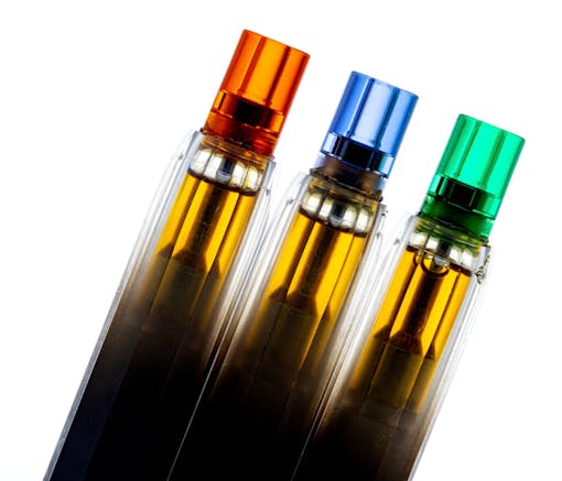 AiroX 1g vape pens with red, blue, and green caps lined up leaning angled to the right over a white background