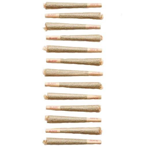 A long set of pre-rolled joints are lined up in the middle of the frame alternating filter and tip placement and photographed from above