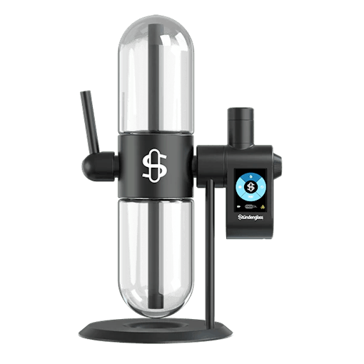 The Stündenglass gravity bong sits against a white background with the Modul dabbing attachement on the righthand side. One of our best dab rigs of 2025.