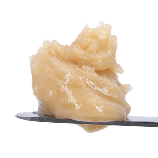 A dab of Northern Lights #5 hash rosin from Arete sits on a metal dabber against a white background, one of our picks for the best THCA concentrates of 2025