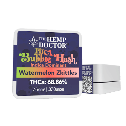 An upright package of Watermelon Z Bubble Hash sits next to one of the same packages sitting flat against a white background. The packaging is navy blue with green and red and white font "Bubble Hash," one of our picks for the best THCA concentrates of 2025