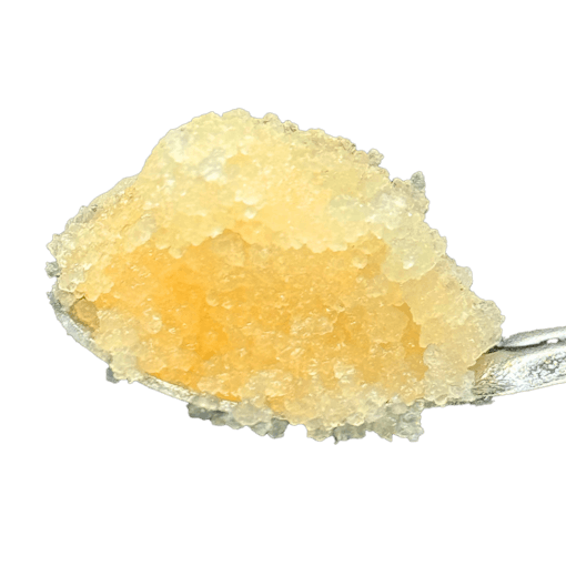 One of our picks for the best THCA concentrates of 2025, a dab of live resin sugar from Crysp sits on a metal scooped dabber against a white background