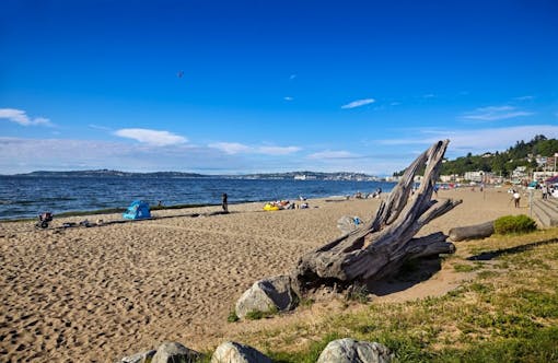 Warm, sunny weather brings people out to Alki Beach, West Seattle, Washington